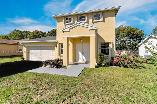 traditional-style home with a front yard, an attached garage, fence, and stucco siding