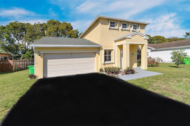 traditional home featuring stucco siding, driveway, fence, a front yard, and a garage