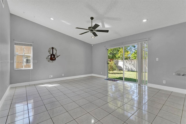 tiled empty room with baseboards, recessed lighting, ceiling fan, vaulted ceiling, and a textured ceiling