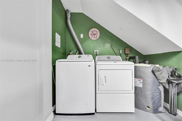 washroom with laundry area and washing machine and clothes dryer