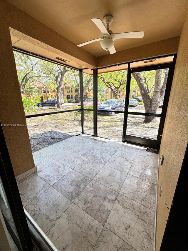 interior space with a ceiling fan