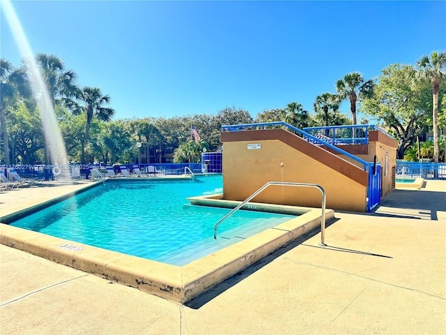 view of pool with fence