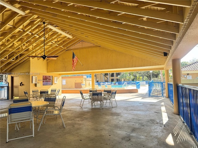 view of patio featuring outdoor dining space and a community pool