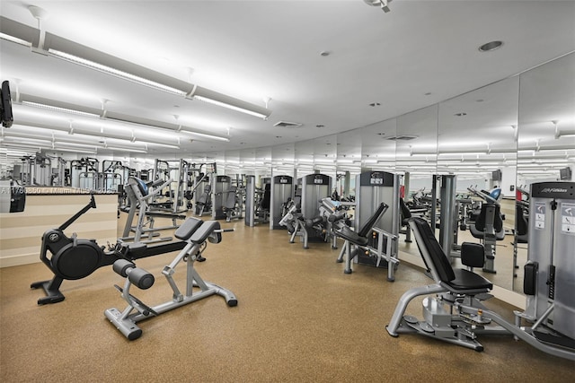 exercise room featuring visible vents