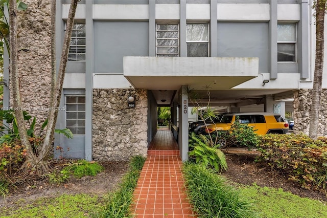 property entrance featuring stone siding