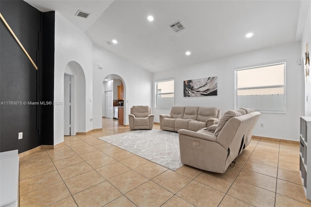 living area with recessed lighting, visible vents, and light tile patterned flooring
