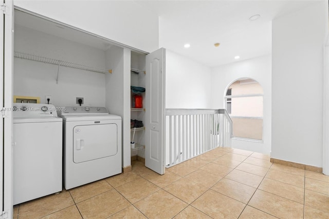 laundry room with laundry area, light tile patterned flooring, separate washer and dryer, and recessed lighting