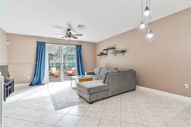 living room with ceiling fan, visible vents, baseboards, and light tile patterned flooring