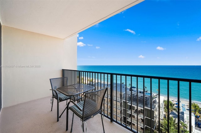 balcony with a view of the beach and a water view