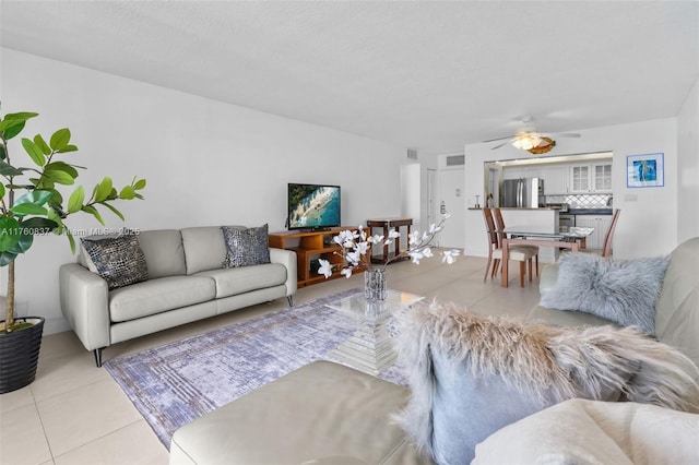 living room with light tile patterned floors and ceiling fan