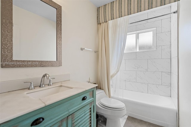 full bath with vanity, toilet, and shower / bath combo