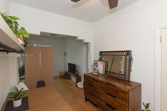 interior space featuring a ceiling fan and wood finished floors