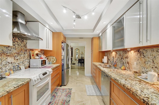 2000 Island Bl Unit 410, Aventura, FL 33160 - kitchen featuring wall chimney range hood, a tray ceiling, light tile patterned floors, stainless steel appliances, and a sink