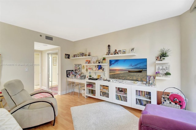 2000 Island Bl Unit 410, Aventura, FL 33160 - living room featuring visible vents, baseboards, and wood finished floors