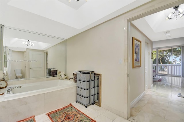 2000 Island Bl Unit 410, Aventura, FL 33160 - full bathroom with a bath, tile patterned flooring, toilet, and baseboards