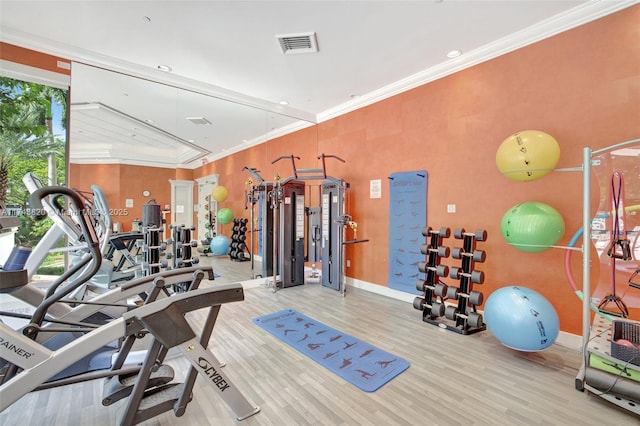 2000 Island Bl Unit 410, Aventura, FL 33160 - workout area with crown molding, wood finished floors, visible vents, and baseboards