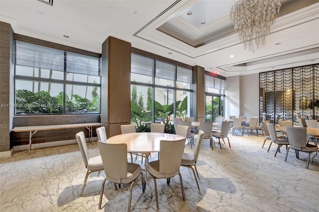2000 Island Bl Unit 410, Aventura, FL 33160 - dining area with an inviting chandelier, a tray ceiling, a high ceiling, stone finish flooring, and crown molding