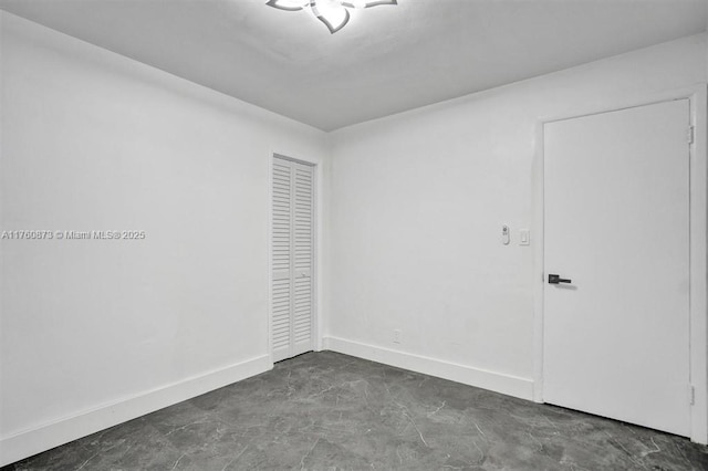 empty room with baseboards