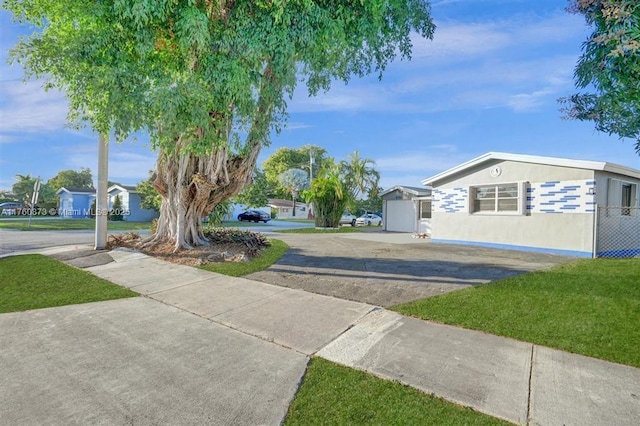 view of street featuring concrete driveway