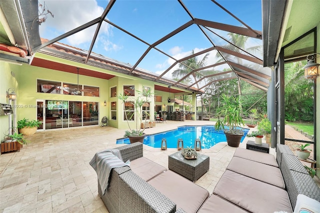 pool with glass enclosure, a patio, and outdoor lounge area