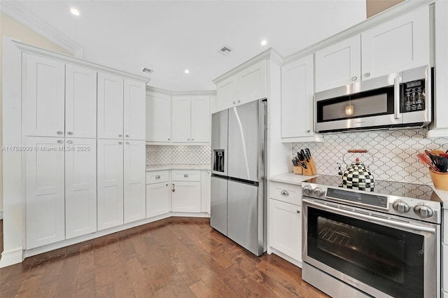 kitchen featuring dark wood-style floors, visible vents, white cabinets, and stainless steel appliances