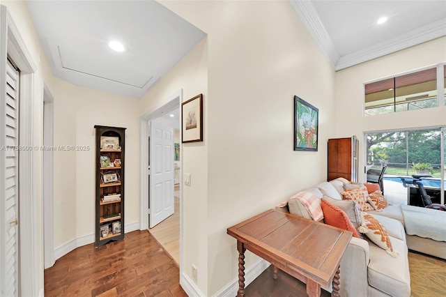 interior space featuring crown molding, recessed lighting, wood finished floors, and baseboards