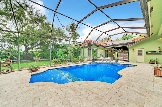 outdoor pool featuring an outdoor living space, glass enclosure, and a patio