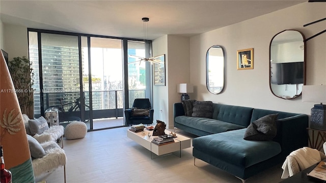 living area with floor to ceiling windows and wood finished floors