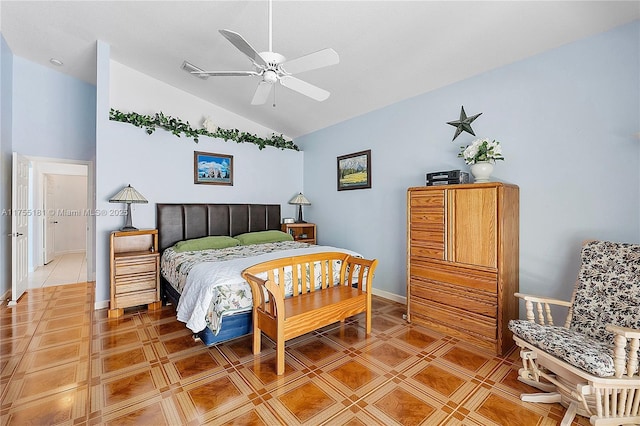 bedroom featuring baseboards, light tile patterned flooring, a ceiling fan, and vaulted ceiling