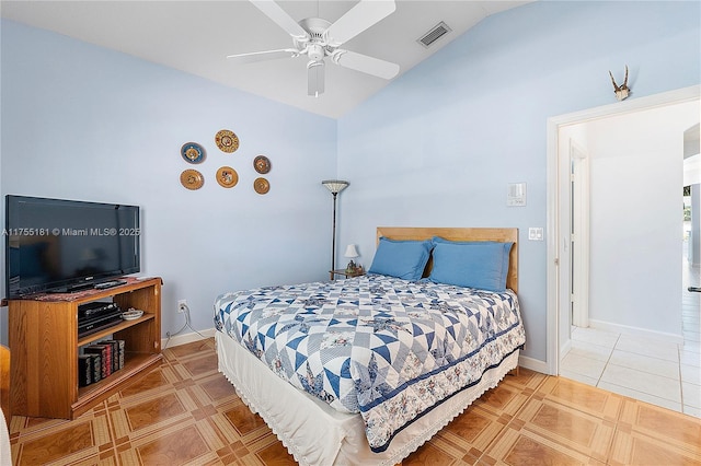 tiled bedroom featuring lofted ceiling, baseboards, visible vents, and ceiling fan