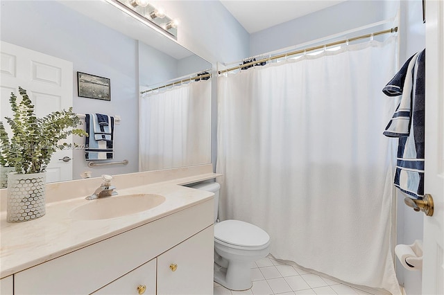 full bathroom featuring tile patterned flooring, toilet, and vanity