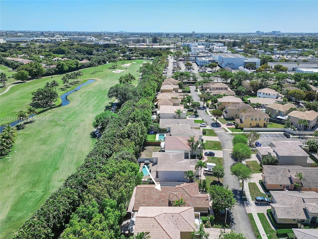 bird's eye view with view of golf course and a residential view