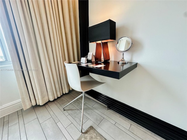 office area featuring tile patterned floors and baseboards