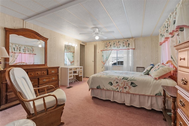 carpeted bedroom featuring a textured ceiling and ceiling fan