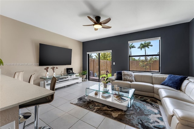 living room with light tile patterned floors and ceiling fan