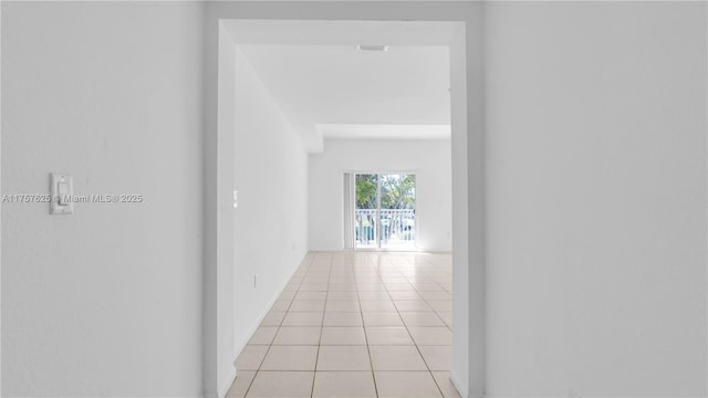 hallway featuring light tile patterned flooring