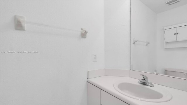 bathroom with visible vents and vanity