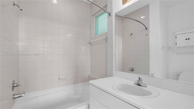 bathroom with vanity and shower / washtub combination