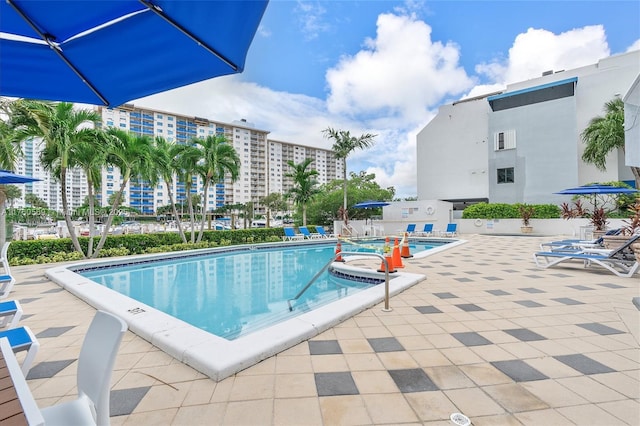 community pool featuring a patio area