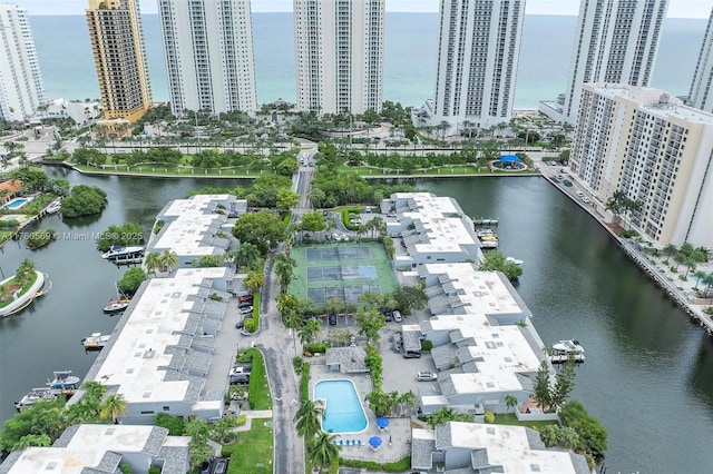 drone / aerial view with a water view and a view of city