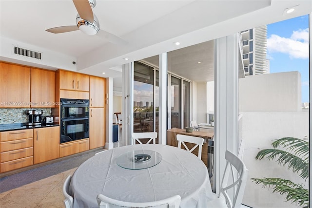 19111 Collins Ave Unit 504, Sunny Isles Beach, FL 33160 - kitchen featuring decorative backsplash, dobule oven black, ceiling fan, visible vents, and recessed lighting