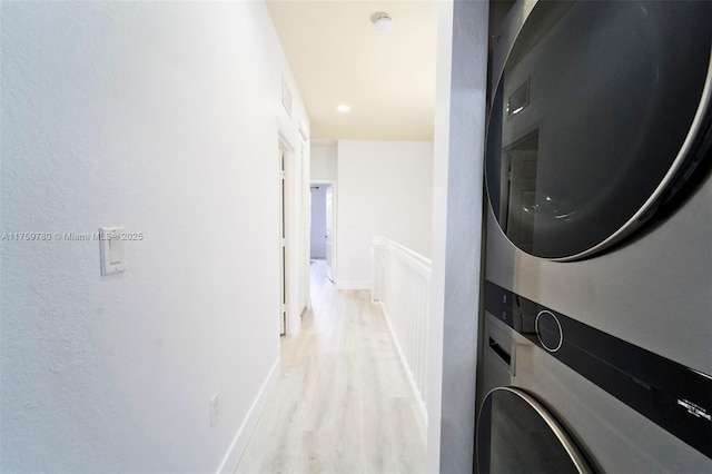 8861 W 35th Ave, Hialeah, FL 33018 - washroom with baseboards, visible vents, laundry area, stacked washer and dryer, and light wood-style floors