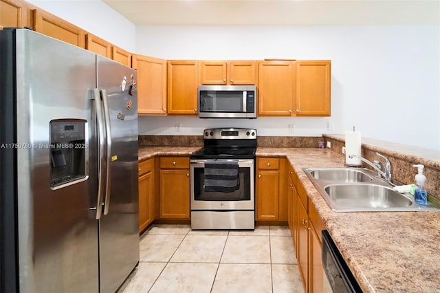 8861 W 35th Ave, Hialeah, FL 33018 - kitchen featuring brown cabinetry, light tile patterned flooring, a sink, stainless steel appliances, and light countertops