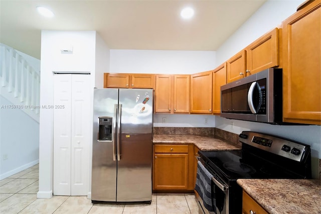 8861 W 35th Ave, Hialeah, FL 33018 - kitchen featuring light tile patterned floors, recessed lighting, and stainless steel appliances