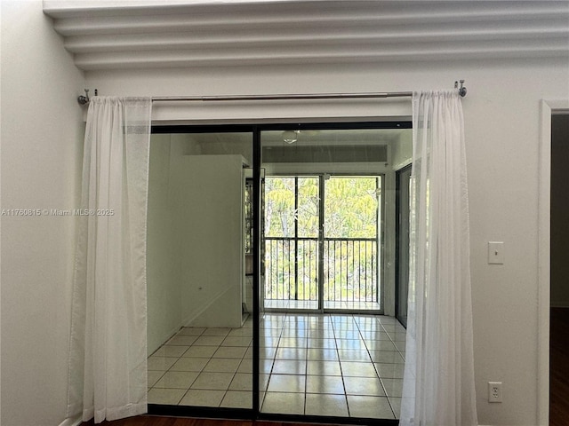 doorway to outside featuring tile patterned flooring