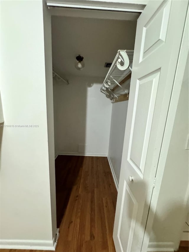 spacious closet with wood finished floors