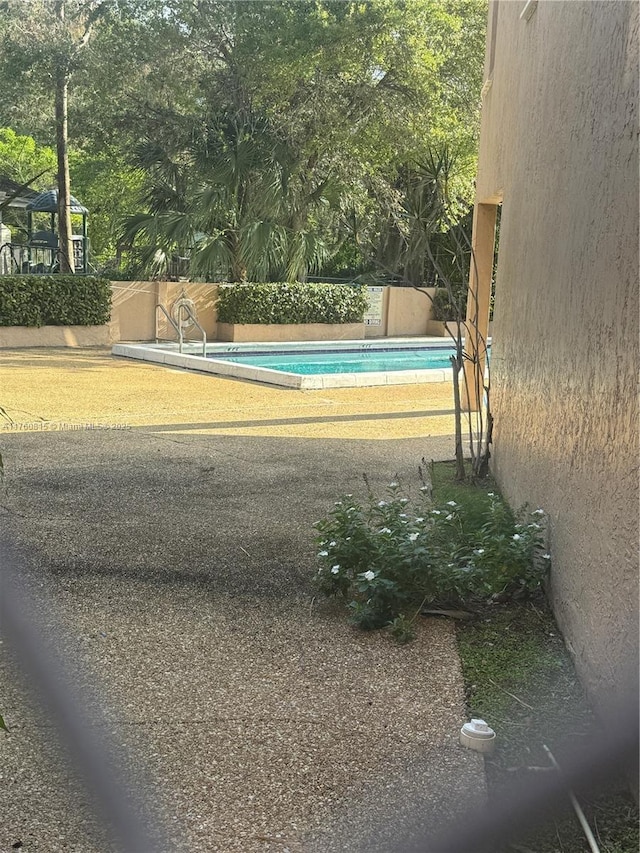 view of pool with a fenced in pool