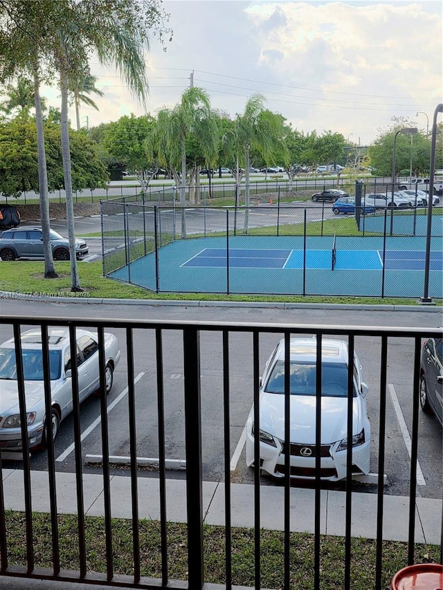 view of tennis court with fence