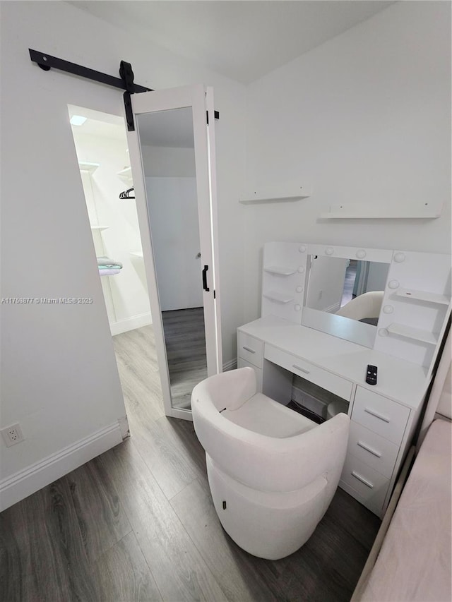 bathroom featuring baseboards and wood finished floors