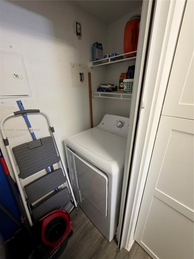 laundry room with washer / dryer, wood finished floors, and laundry area